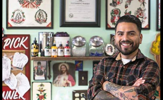 Edgar Guardiola tattoo artist in shop