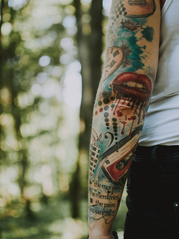 a full color sleeve tattoo close up