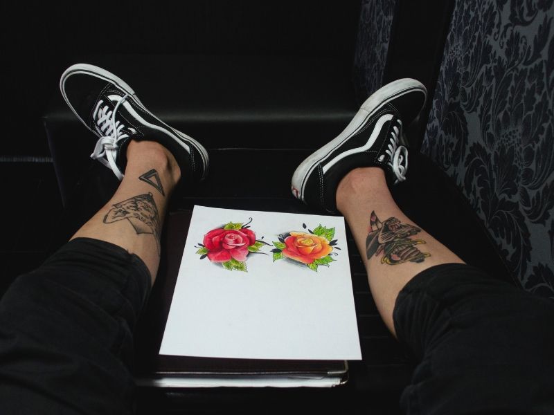 a tattoo artist shows his work