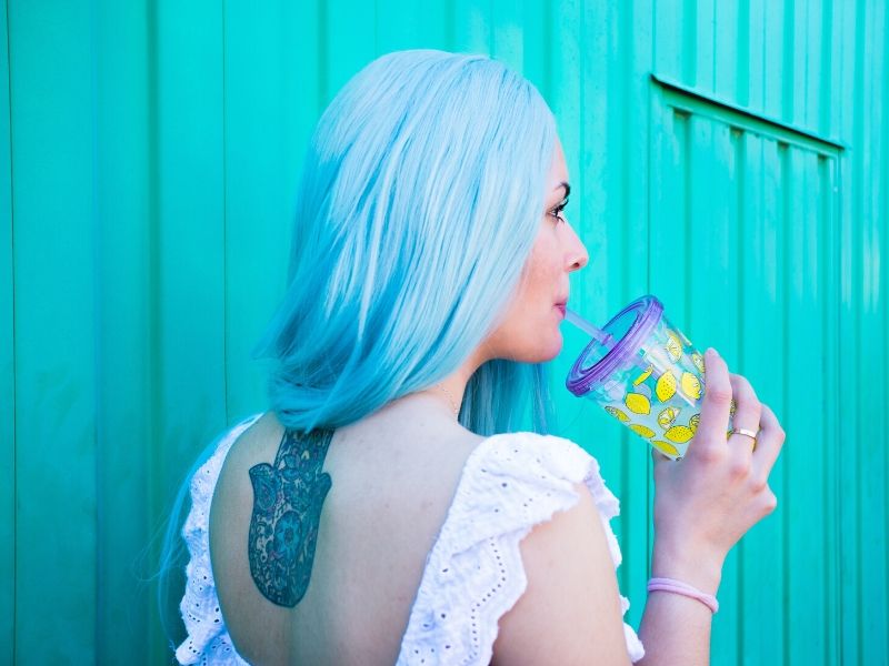 female creative business owner with blue hair