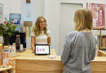 front desk employee talking to customer