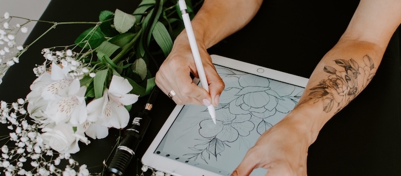 tattoo artist designing an idea