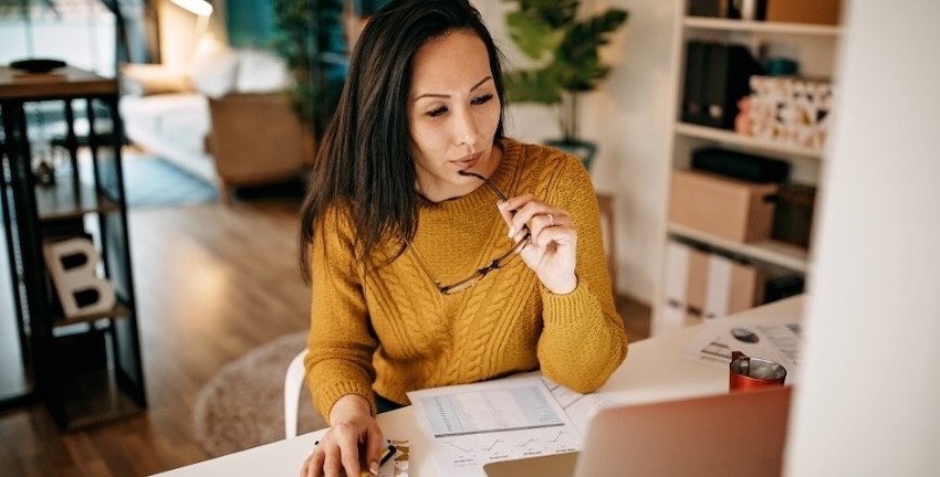 entrepreneur checking materials for errors or typos