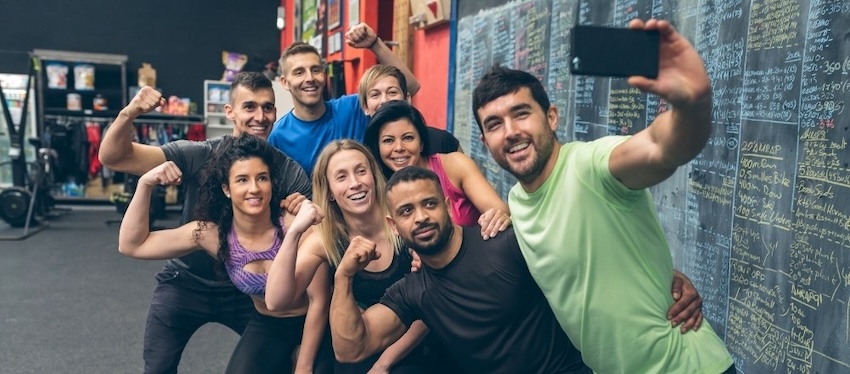gym clients taking selfies for social media