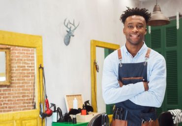 barber at a barbershop with business