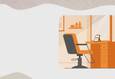 Empty salon chair next to a phone displaying an appointment reminder