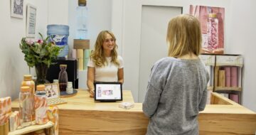 front desk employee talking to customer